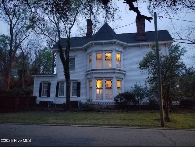 311 E Church St, Tarboro, NC 27886 - italianate home featuring a front lawn and a chimney