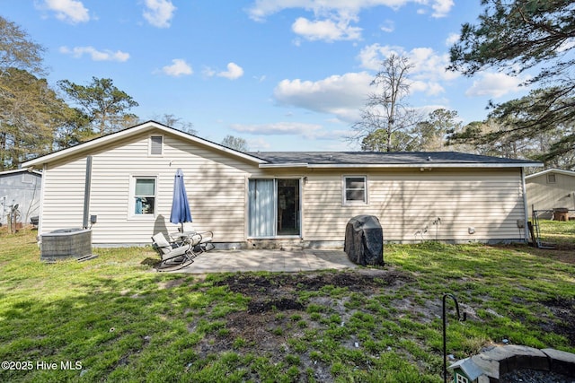 back of property featuring a patio, central AC unit, and a lawn