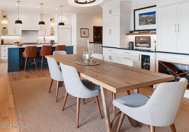 dining space featuring light wood-style floors and recessed lighting