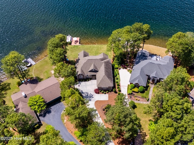 drone / aerial view with a water view and a residential view