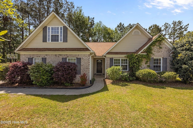 301 Derby Park Ave, New Bern, NC 28562 - view of front of house with a shingled roof, a front lawn, and brick siding