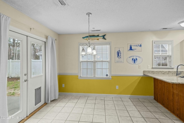 301 Derby Park Ave, New Bern, NC 28562 - unfurnished dining area with visible vents, a textured ceiling, and a healthy amount of sunlight