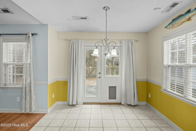 301 Derby Park Ave, New Bern, NC 28562 - unfurnished dining area featuring visible vents, a textured ceiling, and a chandelier
