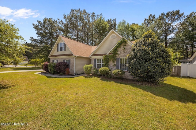 301 Derby Park Ave, New Bern, NC 28562 - view of front of home with fence, a front lawn, and brick siding