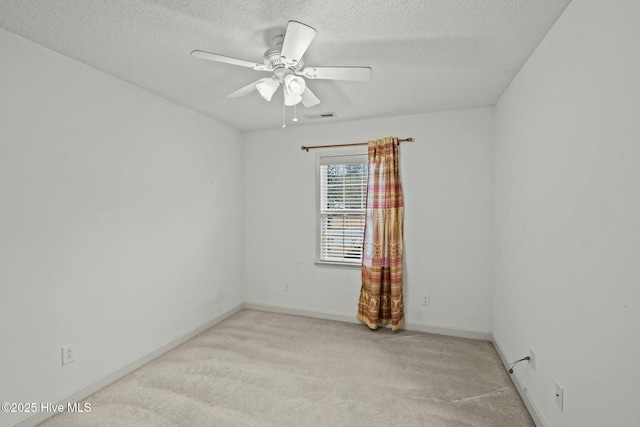 301 Derby Park Ave, New Bern, NC 28562 - spare room featuring baseboards, ceiling fan, light carpet, and a textured ceiling