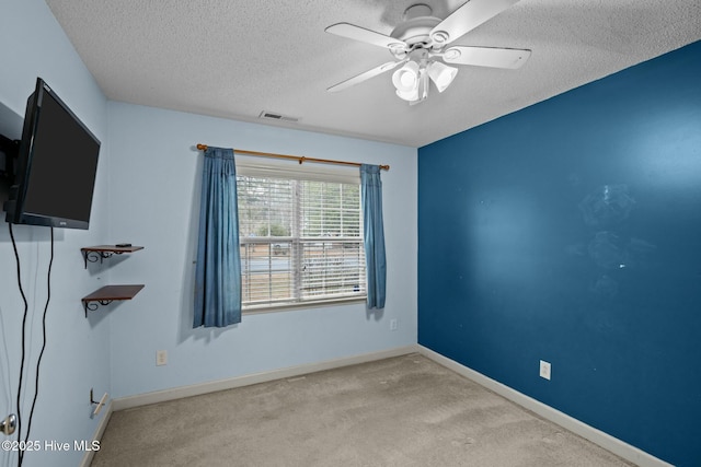301 Derby Park Ave, New Bern, NC 28562 - carpeted spare room with visible vents, a textured ceiling, ceiling fan, and baseboards