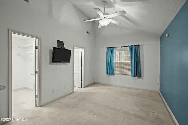301 Derby Park Ave, New Bern, NC 28562 - unfurnished bedroom with a textured ceiling, a spacious closet, baseboards, and carpet