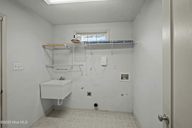 301 Derby Park Ave, New Bern, NC 28562 - clothes washing area with laundry area, baseboards, electric dryer hookup, a sink, and washer hookup