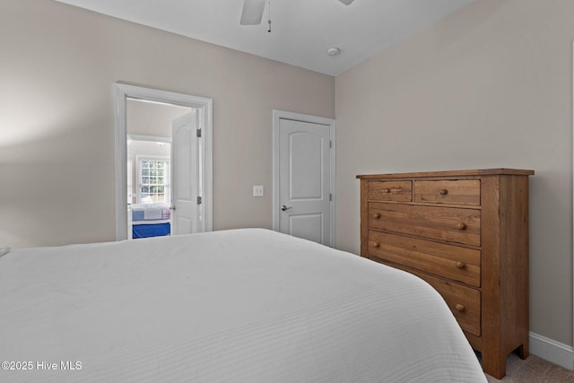 bedroom with baseboards, ceiling fan, and carpet