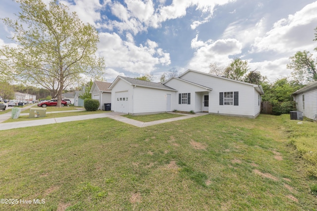 3002 E Windgate Ct, Jacksonville, NC 28546 - view of front of property with central AC unit, a garage, concrete driveway, a front yard, and an outbuilding