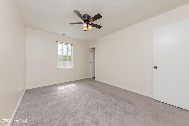 3002 E Windgate Ct, Jacksonville, NC 28546 - carpeted spare room with a ceiling fan, baseboards, and a textured ceiling