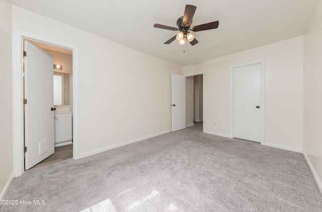 3002 E Windgate Ct, Jacksonville, NC 28546 - unfurnished bedroom featuring carpet floors, ensuite bath, and baseboards