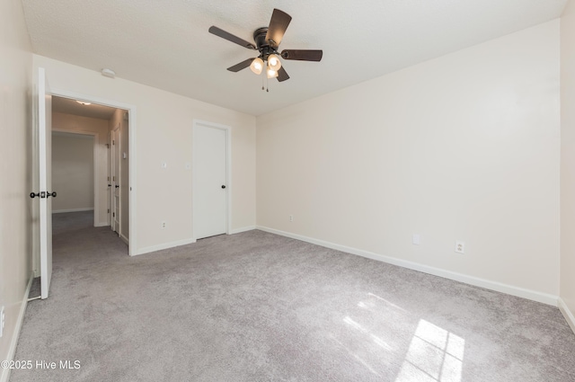 3002 E Windgate Ct, Jacksonville, NC 28546 - unfurnished bedroom with baseboards, ceiling fan, and carpet flooring