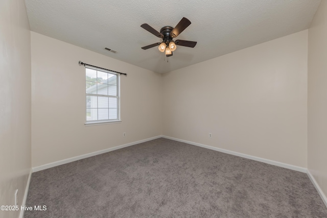 3002 E Windgate Ct, Jacksonville, NC 28546 - spare room with carpet, baseboards, a textured ceiling, visible vents, and a ceiling fan