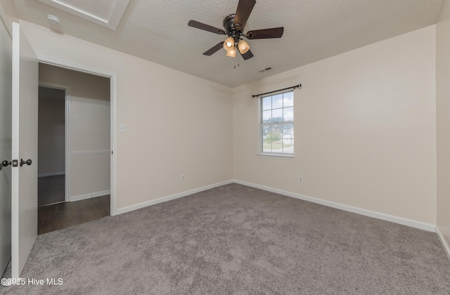 3002 E Windgate Ct, Jacksonville, NC 28546 - empty room with a textured ceiling, visible vents, carpet flooring, and a ceiling fan
