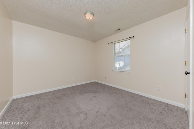 3002 E Windgate Ct, Jacksonville, NC 28546 - carpeted empty room with baseboards, a textured ceiling, and visible vents
