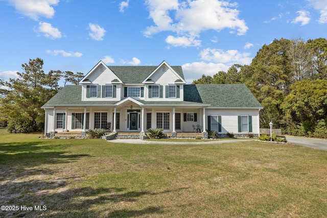 view of front of house featuring a front yard and covered porch