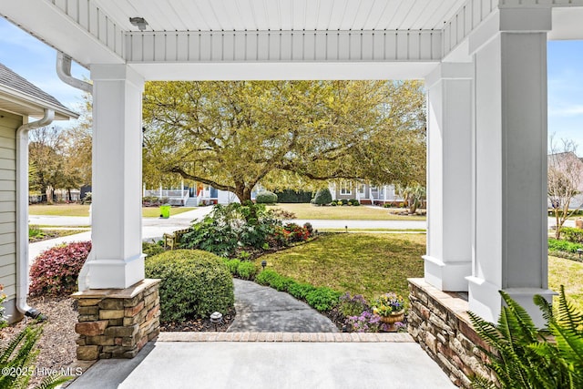 5994 Gray Squirrel Path, Southport, NC 28461 - covered porch with a yard