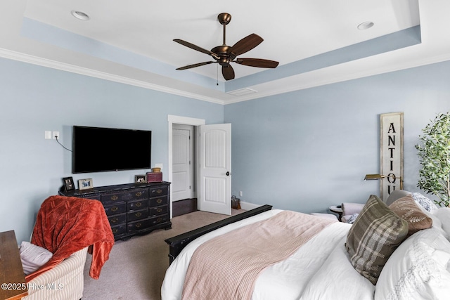 5994 Gray Squirrel Path, Southport, NC 28461 - bedroom with a raised ceiling, carpet flooring, ornamental molding, and a ceiling fan