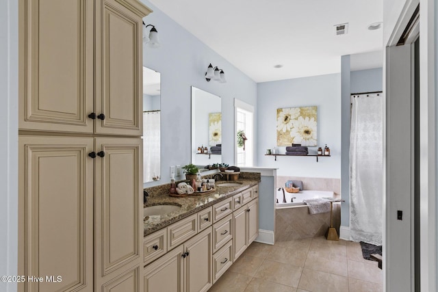 5994 Gray Squirrel Path, Southport, NC 28461 - full bath with double vanity, a bath, and tile patterned flooring