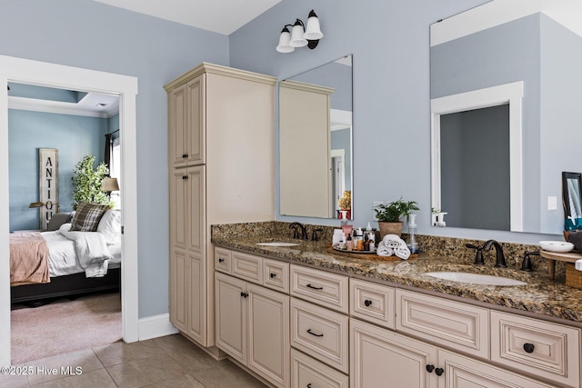 5994 Gray Squirrel Path, Southport, NC 28461 - ensuite bathroom featuring double vanity, tile patterned floors, and baseboards
