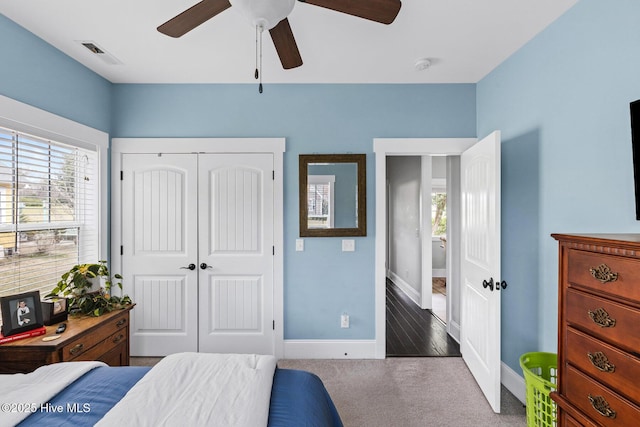 5994 Gray Squirrel Path, Southport, NC 28461 - carpeted bedroom with baseboards, a closet, and ceiling fan