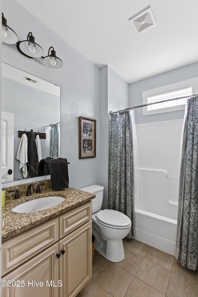 5994 Gray Squirrel Path, Southport, NC 28461 - full bathroom with vanity, toilet, tile patterned floors, and shower / bathtub combination with curtain