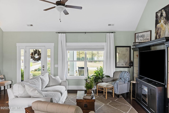 5994 Gray Squirrel Path, Southport, NC 28461 - living room with vaulted ceiling, dark wood-style floors, ceiling fan, and baseboards