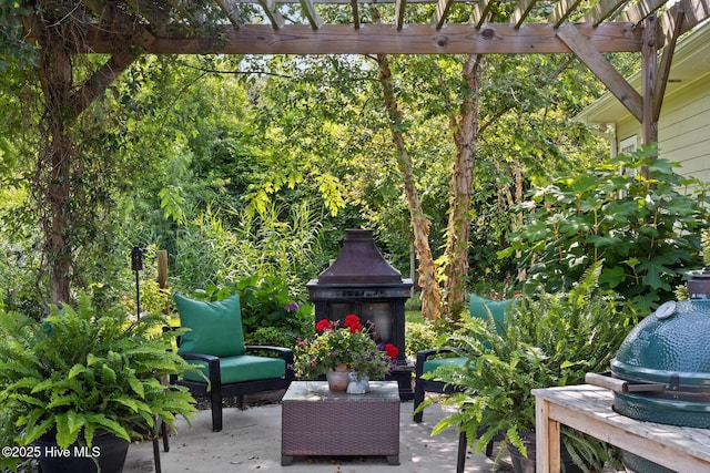 5994 Gray Squirrel Path, Southport, NC 28461 - view of patio featuring a pergola and an outdoor living space with a fireplace