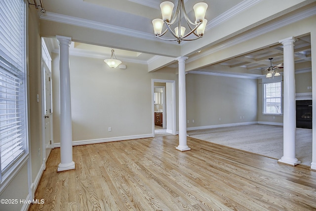 103 Whistling Duck Ct, Moyock, NC 27958 - unfurnished living room with crown molding, ceiling fan, baseboards, wood finished floors, and a chandelier