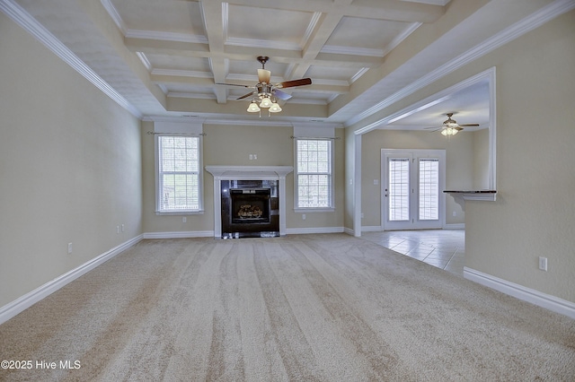 103 Whistling Duck Ct, Moyock, NC 27958 - unfurnished living room with a ceiling fan, carpet flooring, a fireplace, beamed ceiling, and crown molding