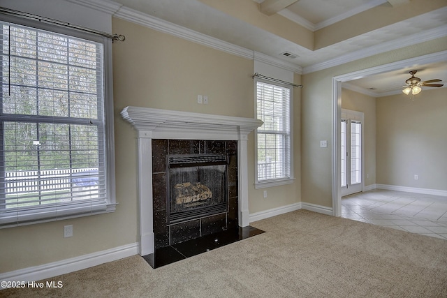 103 Whistling Duck Ct, Moyock, NC 27958 - unfurnished living room featuring plenty of natural light, carpet, a tile fireplace, and crown molding