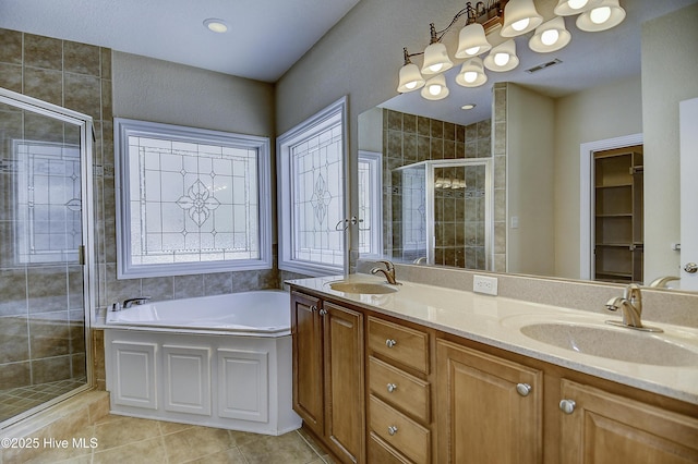 103 Whistling Duck Ct, Moyock, NC 27958 - full bathroom featuring a shower stall, a garden tub, double vanity, and tile patterned floors