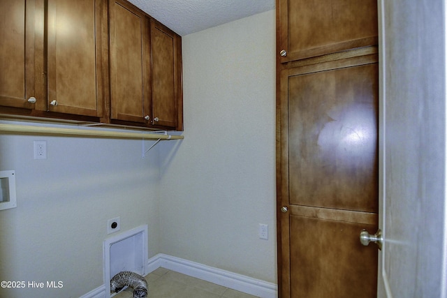 103 Whistling Duck Ct, Moyock, NC 27958 - washroom with cabinet space, electric dryer hookup, baseboards, hookup for a washing machine, and a textured ceiling