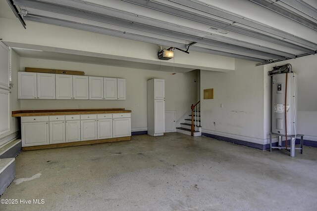 103 Whistling Duck Ct, Moyock, NC 27958 - garage featuring water heater and a garage door opener