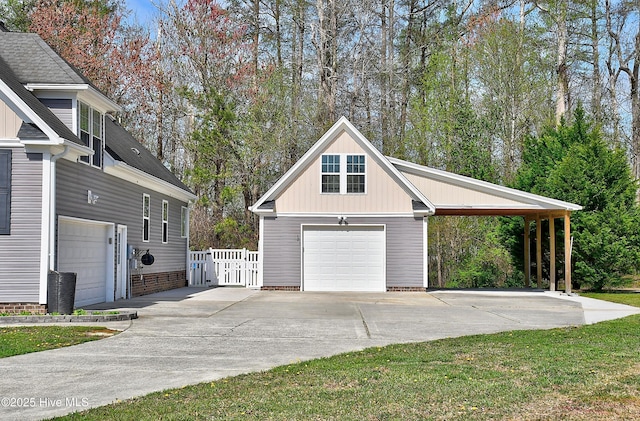 103 Whistling Duck Ct, Moyock, NC 27958 - view of property exterior featuring concrete driveway, board and batten siding, and an outdoor structure