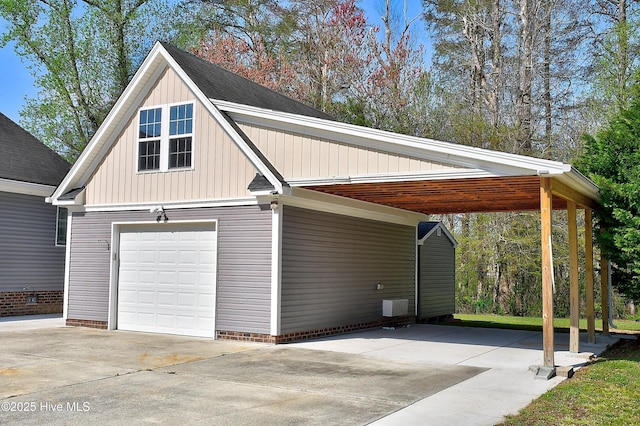 103 Whistling Duck Ct, Moyock, NC 27958 - garage featuring driveway and a carport