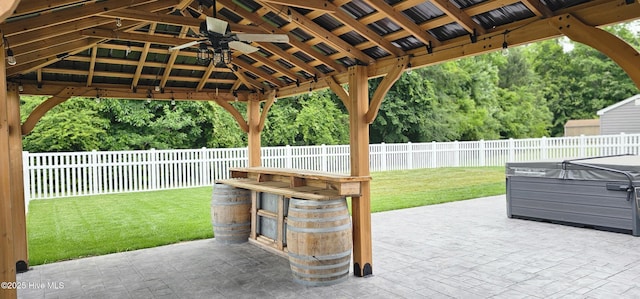 103 Whistling Duck Ct, Moyock, NC 27958 - view of patio / terrace featuring a hot tub, ceiling fan, and a gazebo