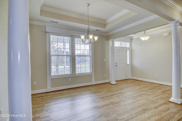 103 Whistling Duck Ct, Moyock, NC 27958 - foyer with ornate columns, wood finished floors, a raised ceiling, and crown molding