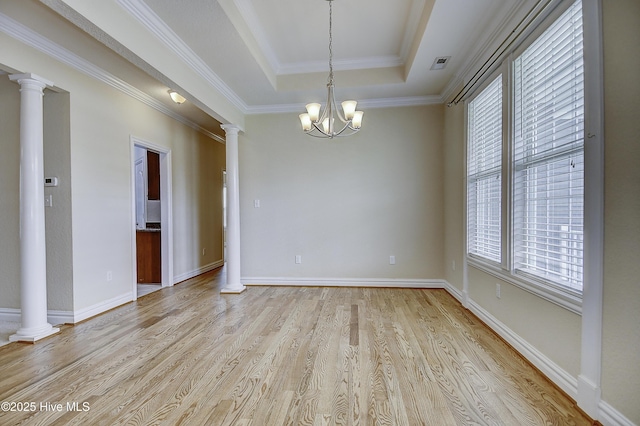 103 Whistling Duck Ct, Moyock, NC 27958 - unfurnished room featuring a tray ceiling, plenty of natural light, decorative columns, light wood-type flooring, and ornamental molding