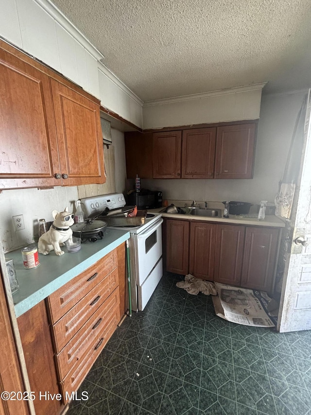 kitchen with white electric range oven, a textured ceiling, light countertops, and brown cabinetry