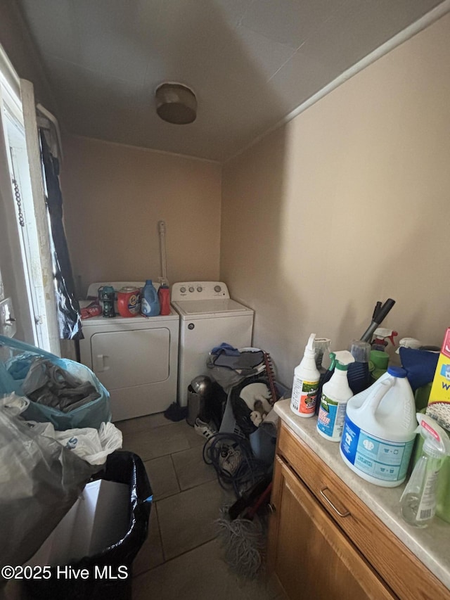 washroom with independent washer and dryer and laundry area