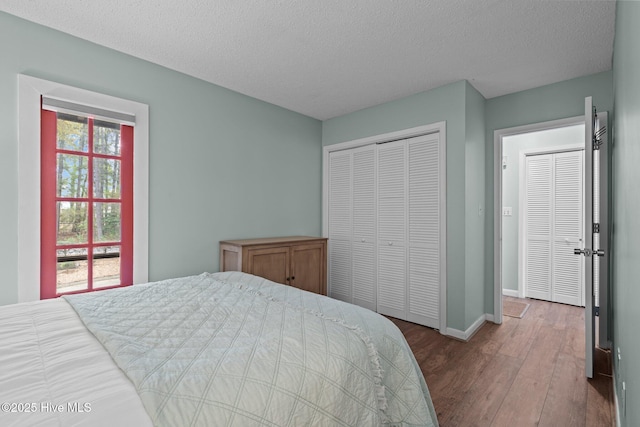 5 Pine Tree Rd Unit 211, Pinehurst, NC 28374 - bedroom with wood finished floors, baseboards, a textured ceiling, and a closet