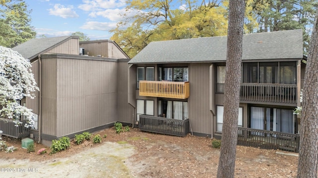 5 Pine Tree Rd Unit 211, Pinehurst, NC 28374 - back of house with a shingled roof and a balcony