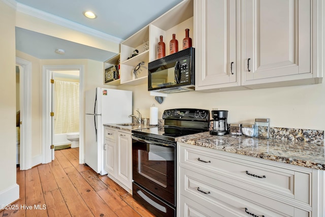 kitchen featuring ornamental molding, open shelves, white cabinets, black appliances, and a sink