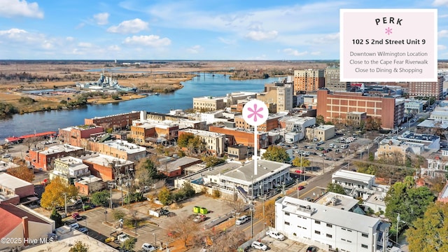 drone / aerial view featuring a water view and a city view