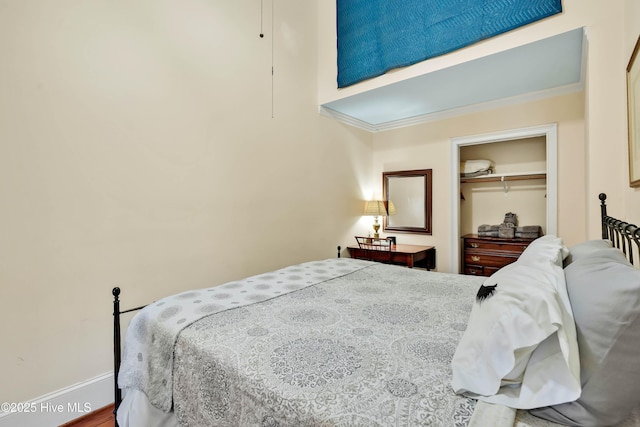 bedroom featuring a closet and baseboards