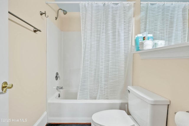 full bathroom featuring shower / tub combo with curtain and toilet