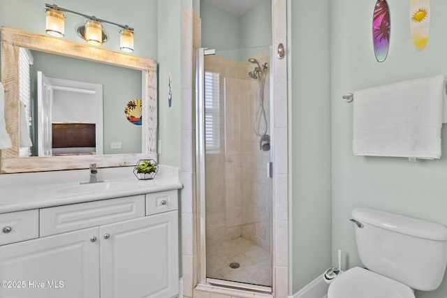 full bath featuring a shower stall, toilet, and vanity