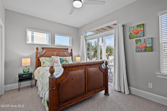 bedroom with baseboards, a ceiling fan, and light carpet